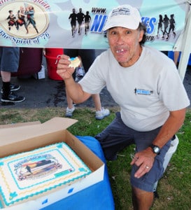 Jake Clinton takes a bite out a cake custom made to celebrate Nite Moves’ 25th Anniversary. (Presidio Sports Photo)